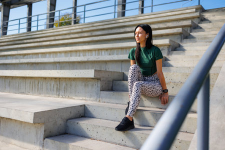 Stylish Athletic Female at Sports Venueの写真素材