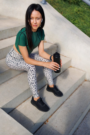 Stylish Brunette Taking a Break at Stadium