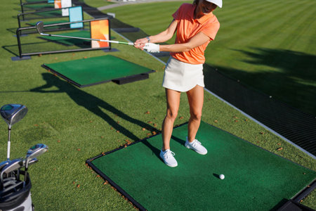 Swinging into Victory: Golfing Charm in Motionの写真素材