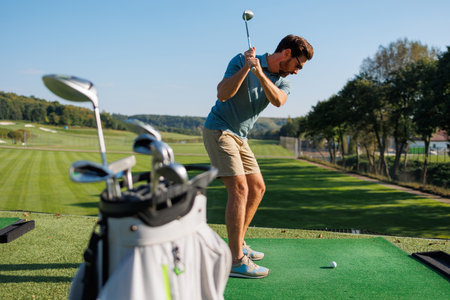 The Art of the Drive: Youthful Golfer in Motionの写真素材