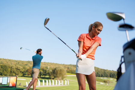 Swinging Together: Youthful Golf Partnersの写真素材
