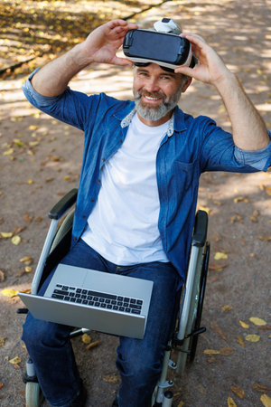 Harmonizing Nature and Innovation: Disabled Person Explores AR Landscape in Parkの写真素材