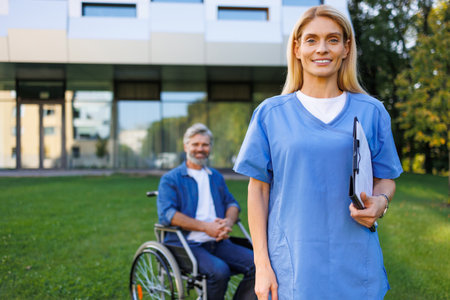 Nurse Assists Patient in Natural Settingの写真素材