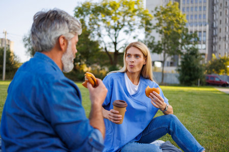 Savoring the moment: Handicapped man and nurse embrace picnic outingの写真素材