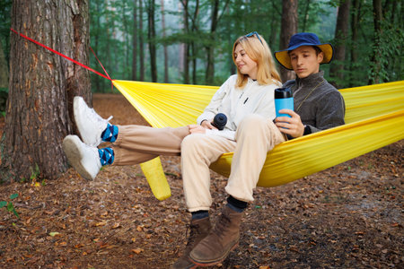 Young Lovers Relaxing in a Hammock in the Wilderness