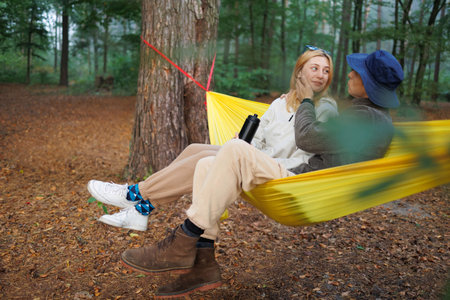 Nature Adventure: Couple Relaxing in Hammock