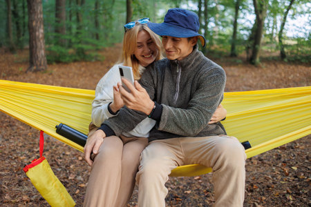 Couple's Hammock Time with Engaging Video Call Interactionの写真素材