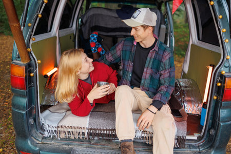 Couple Embraces Tranquility in Forest Camper