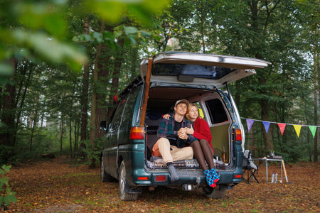 Peaceful Moment: Couple Enjoying Van Life in Forest