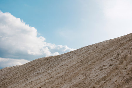 Serene Scene of Golden Sands Beneath a Bright Skyの写真素材