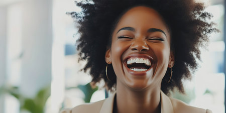 Diverse Woman Sharing Laughter in Modern Officeの素材