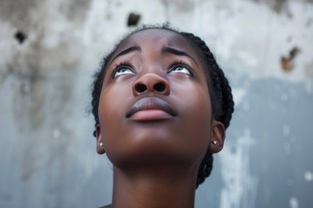 Beautiful woman shedding tears, light shining from aboveの素材