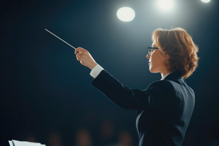 Confident Female Conductor Leading Symphony Orchestraの素材