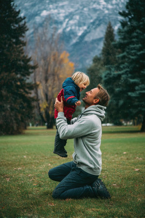 Father Lifting Child in Scenic Parkの素材