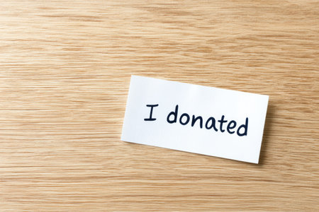 "I Donated" Message on Wooden Surfaceの素材