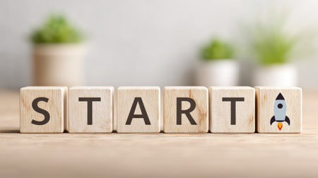 Startup Concept with Wooden Letters and Rocket Iconの素材