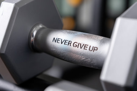 Dumbbell Handle with "Never Give Up" Textの素材