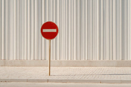 No Entry Traffic Sign Against White Industrial Wallの素材