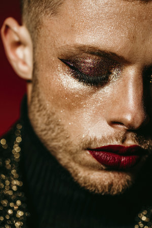 Artistic Close-Up of Glitter Makeup on Man's Faceの素材