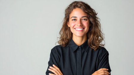 Confident Young Woman Smiling in Black Shirtの素材