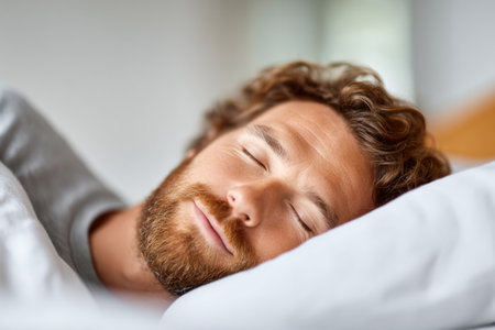Peaceful Man Sleeping in Bedの素材