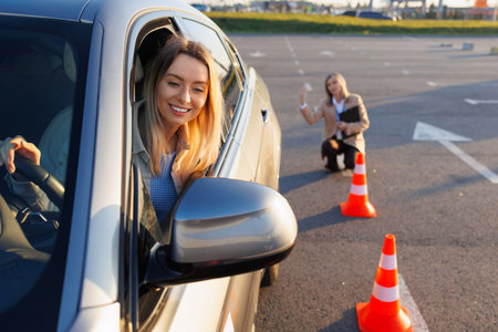 Learner Driver Engaged in Training as Instructor Guides Maneuver Stepsの写真素材
