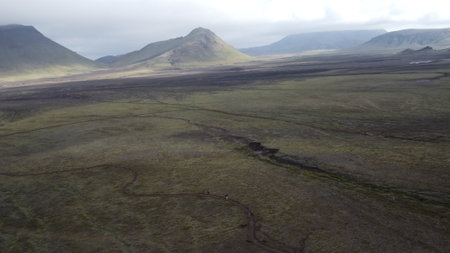 Aerial view of Iceland landscape with a river in the foreground.の写真素材