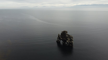Aerial drone view of a rock in the sea. Iceland.の写真素材