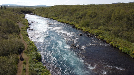 Aerial view of a river flowing through a valley in Iceland.の写真素材