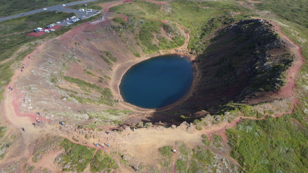 Aerial view of a volcanic crater with a lake in the middleの写真素材