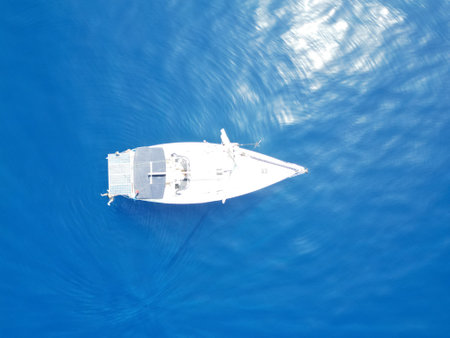 Aerial view of a boat in the blue sea. Top view.の写真素材