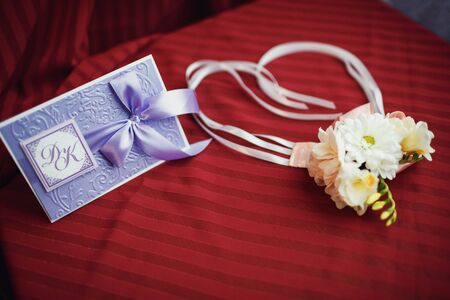 boutonniere of white roses and daisies for the groomの写真素材