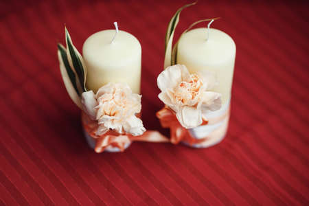 Romantic decoration with two white candlesの写真素材