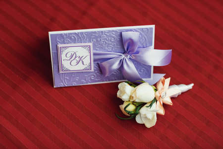 boutonniere of white roses and daisies for the groomの写真素材