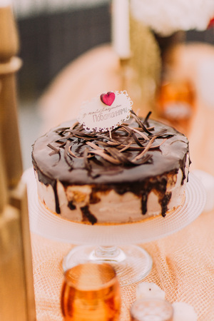 Chocolate wedding cake with candles close up.の写真素材