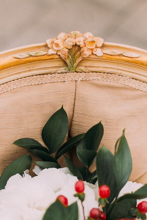 Details of vintage terracotta chair with wedding bouquet close up.の写真素材