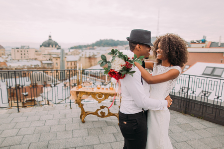 African wedding couple dances on the rooftop. Wedding day.の写真素材