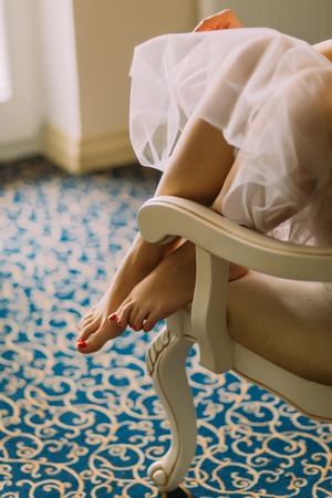 Beautiful brides legs  with bright pedicure close up.の写真素材