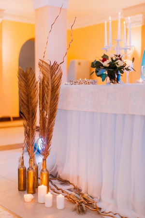 Creative wedding table with cake and candles.の写真素材