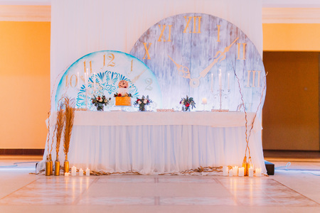 Creative wedding table with cake and candles.の写真素材