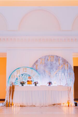 Creative wedding table with cake and candles.の写真素材