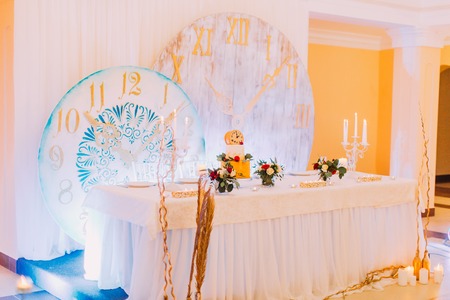 Beautiful decorated with flowers wedding table. Wedding cake. Sweets.の写真素材