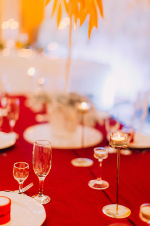 Luxurious wedding table with red tablecloth.  Wedding celebration.の写真素材