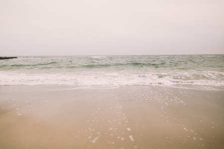 Wonderful icy beach in winter. Sea surf.の写真素材