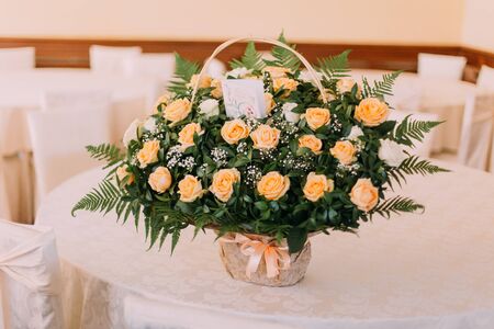 Bouquet of beautiful roses on a white wooden table. Wedding day.の写真素材