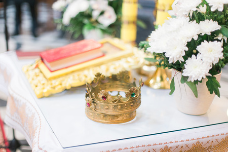Orthodox wedding ceremonial crown and the Bible, ready for a crowning ceremony.の写真素材