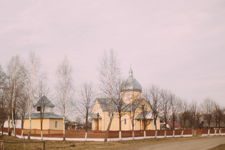 Misty country landscape with church in Ukraine.の写真素材