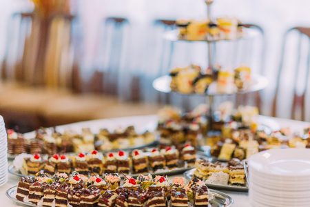 Close-up view collection of tasty assorted mini dessert standing on a table in restaurant.の写真素材
