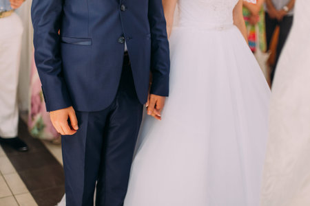 bride and groom at their wedding holding handsの写真素材