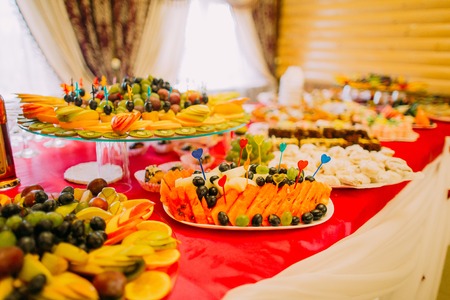 Fancy served fruit buffet on luxurious party table in restaurant.の写真素材
